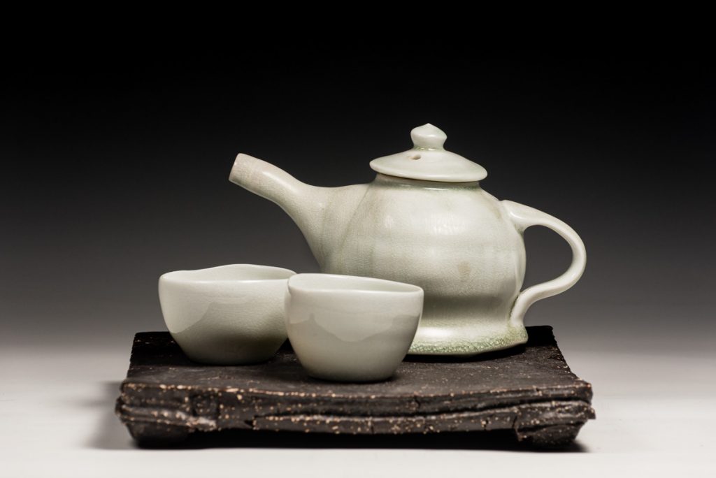 porcelain teapot black stoneware base