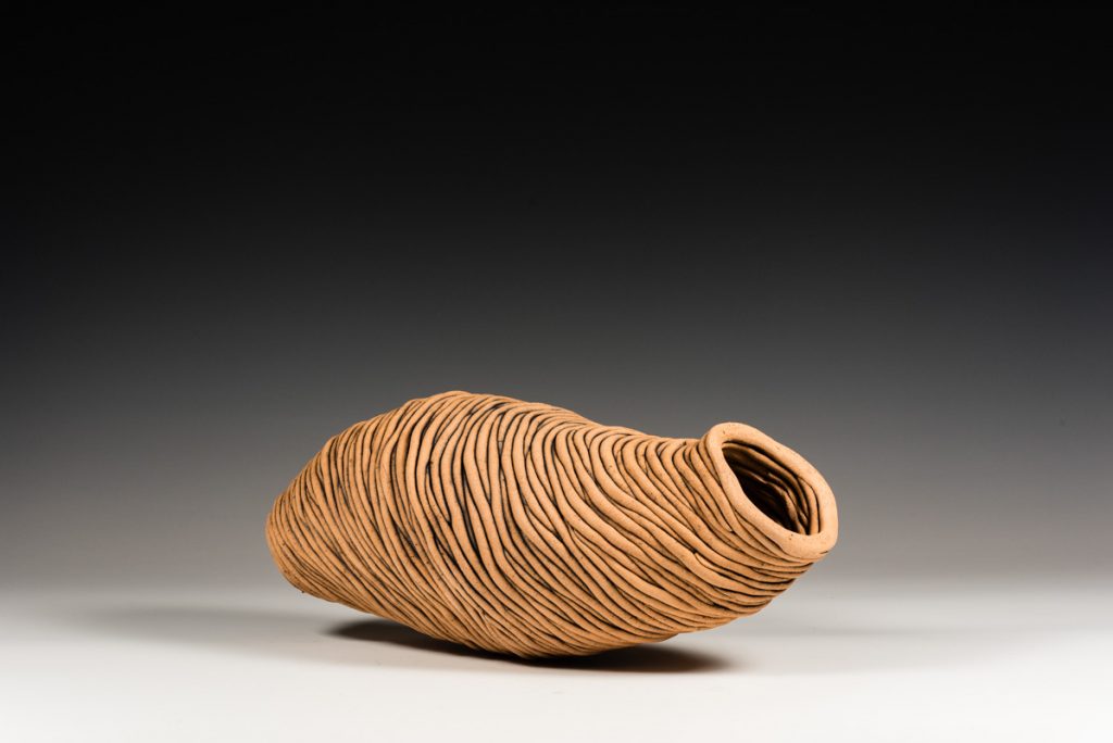 Cathy Keys Coiled and Oxide washed clay wasp nest wall piece